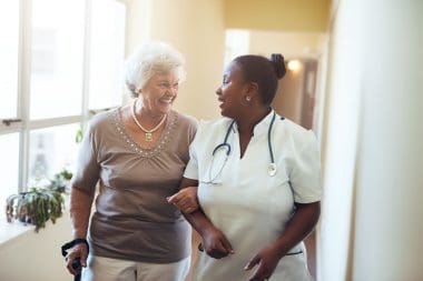 senior nurse walking