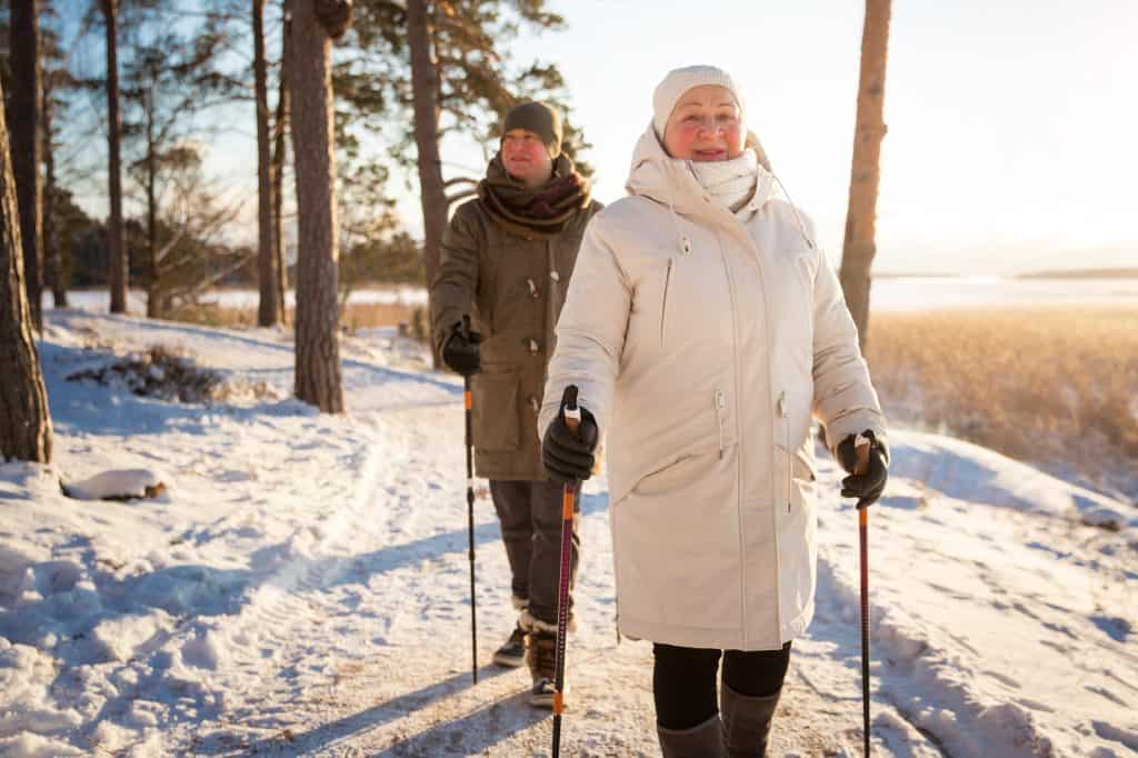 older couple walking in the snow