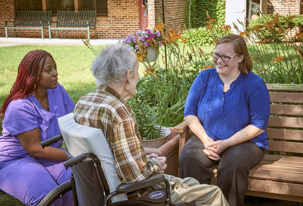 senior with caregivers